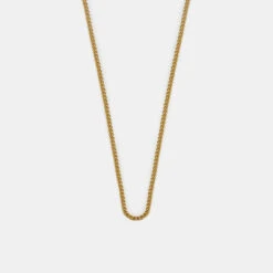 Gold 1.5mm Curb Chain 14 Gold 1.5mm Curb Chain -Serge DeNimes Jewelry Shop Gold Non Adjustable Chain Product Shot Grey