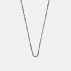 Silver 1.5mm Curb Chain 13 Silver 1.5mm Curb Chain -Serge DeNimes Jewelry Shop Silver Non Adjustable Chain Product Shot Grey